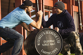 Kauli and Victor wrestle over the end of year prize a 50 litre cask of Scottish Whiskey
